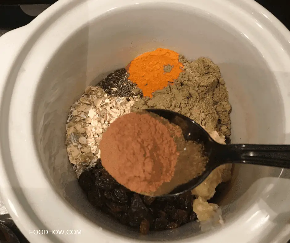 Porridge ingredients in a ceramic slow cooker bowl 