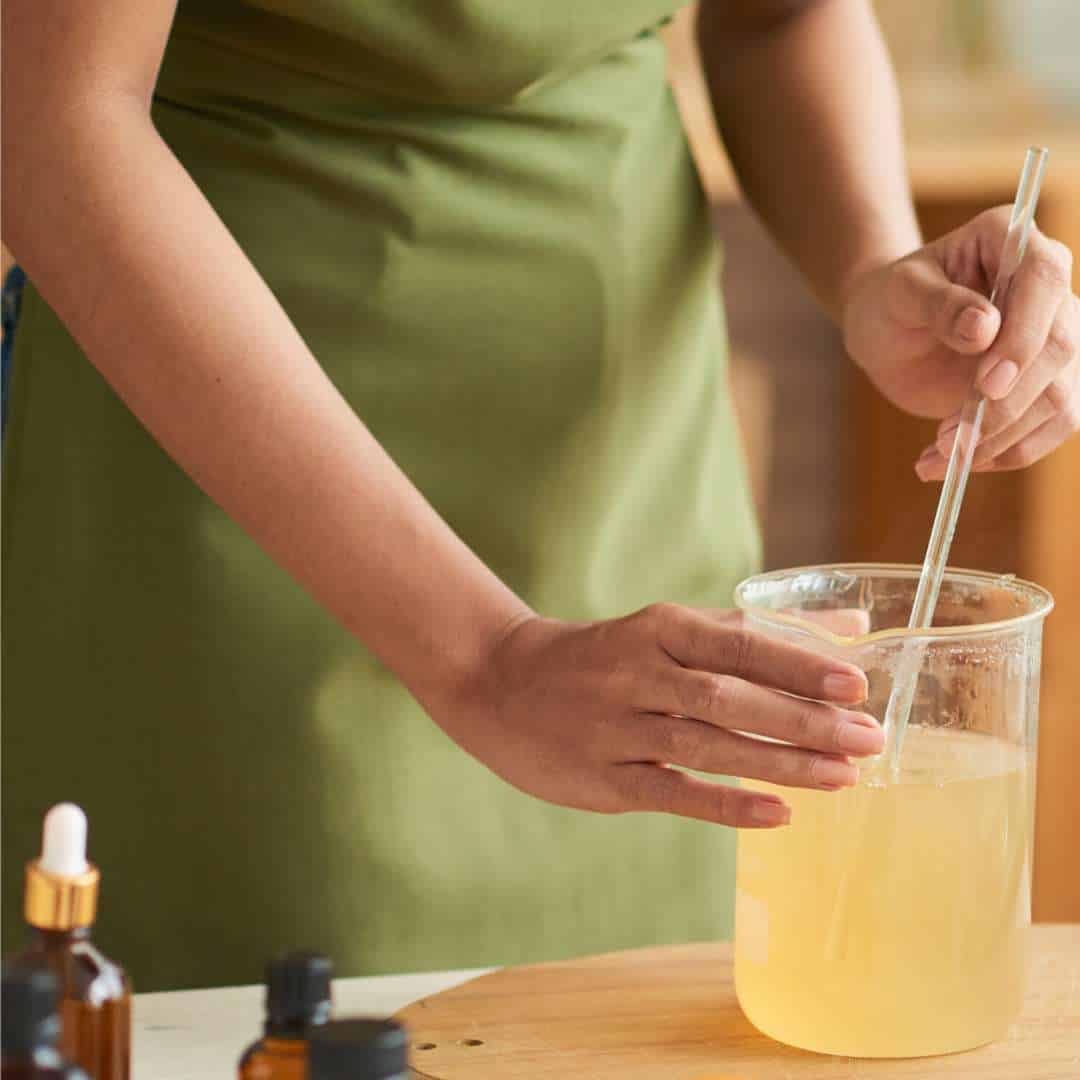 a woman making natural washing up liquid at home