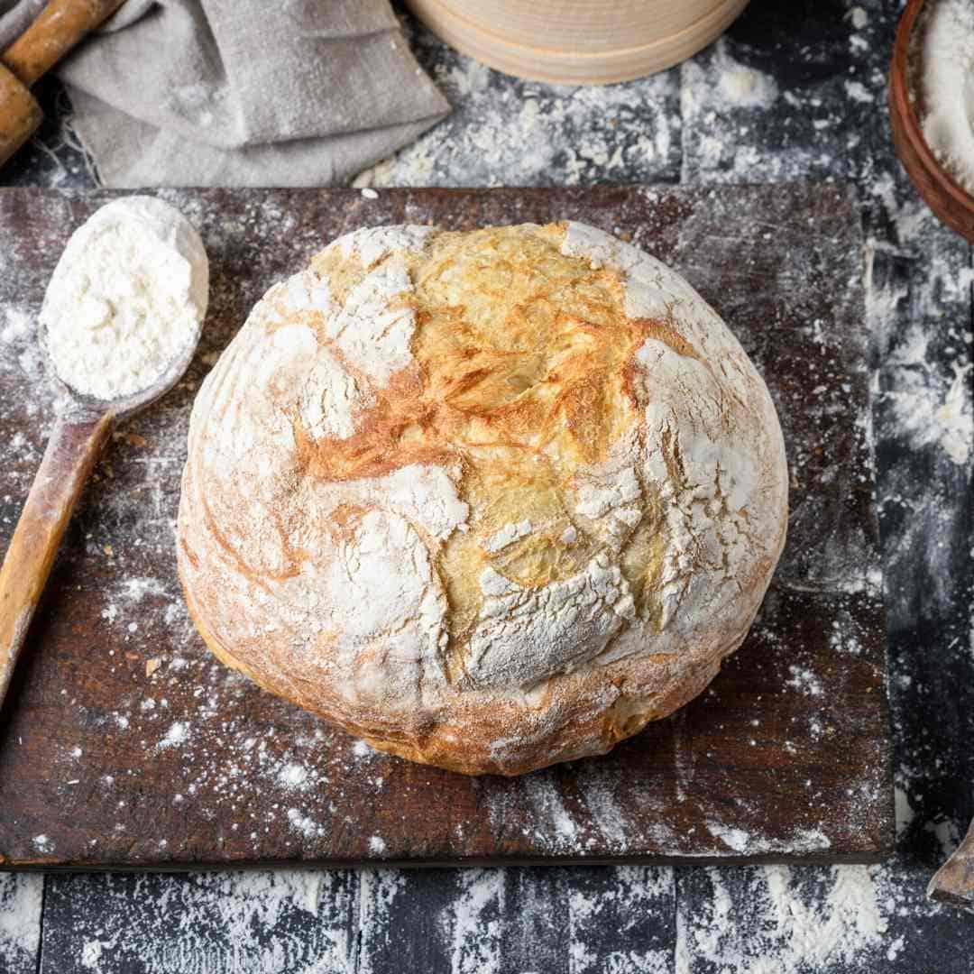 loaf of bread covered with flour