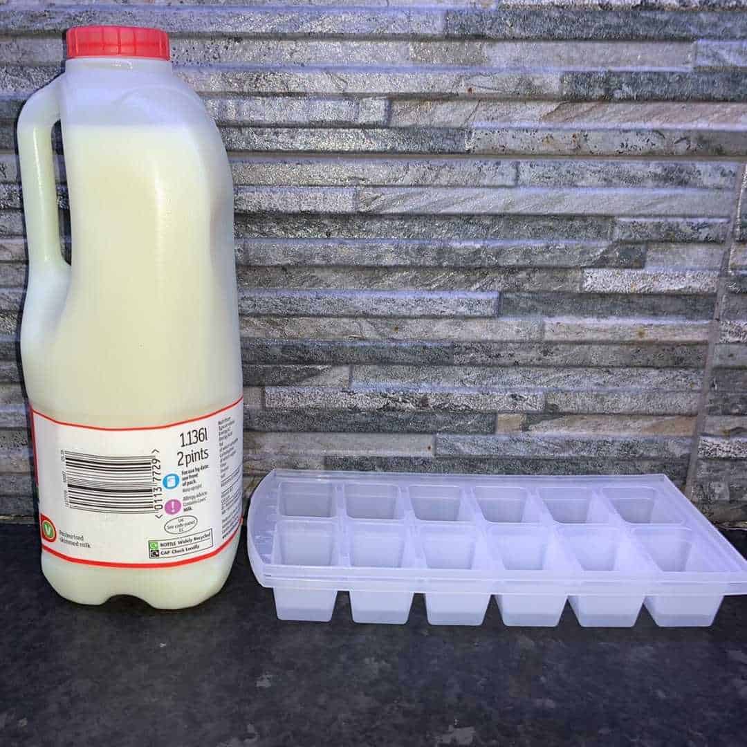 milk next to ice cube trays