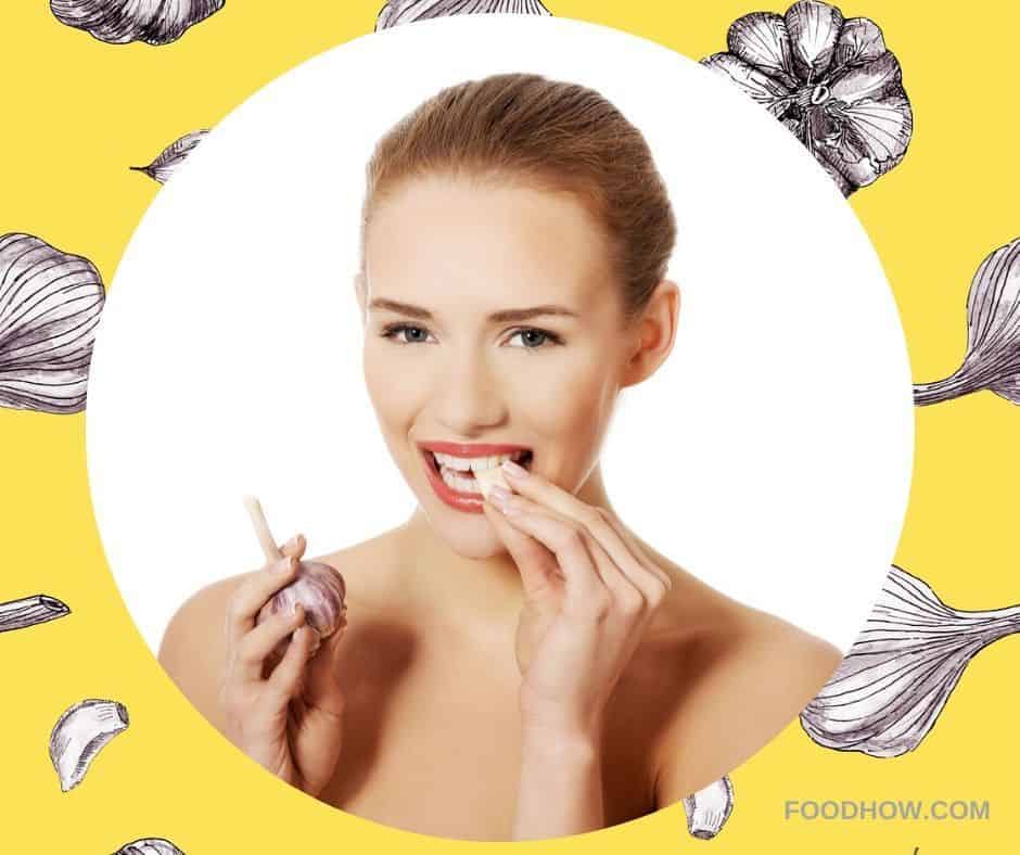 woman eating a garlic clove