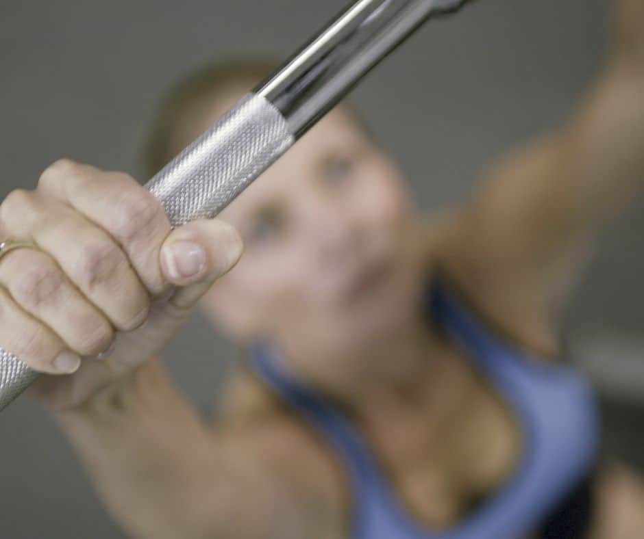 a woman doing pull-ups