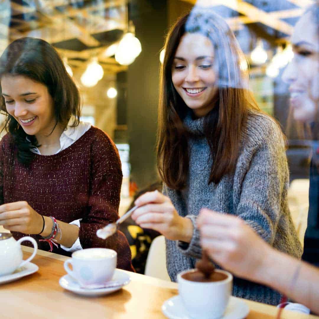 a woman drinking grain coffee drink