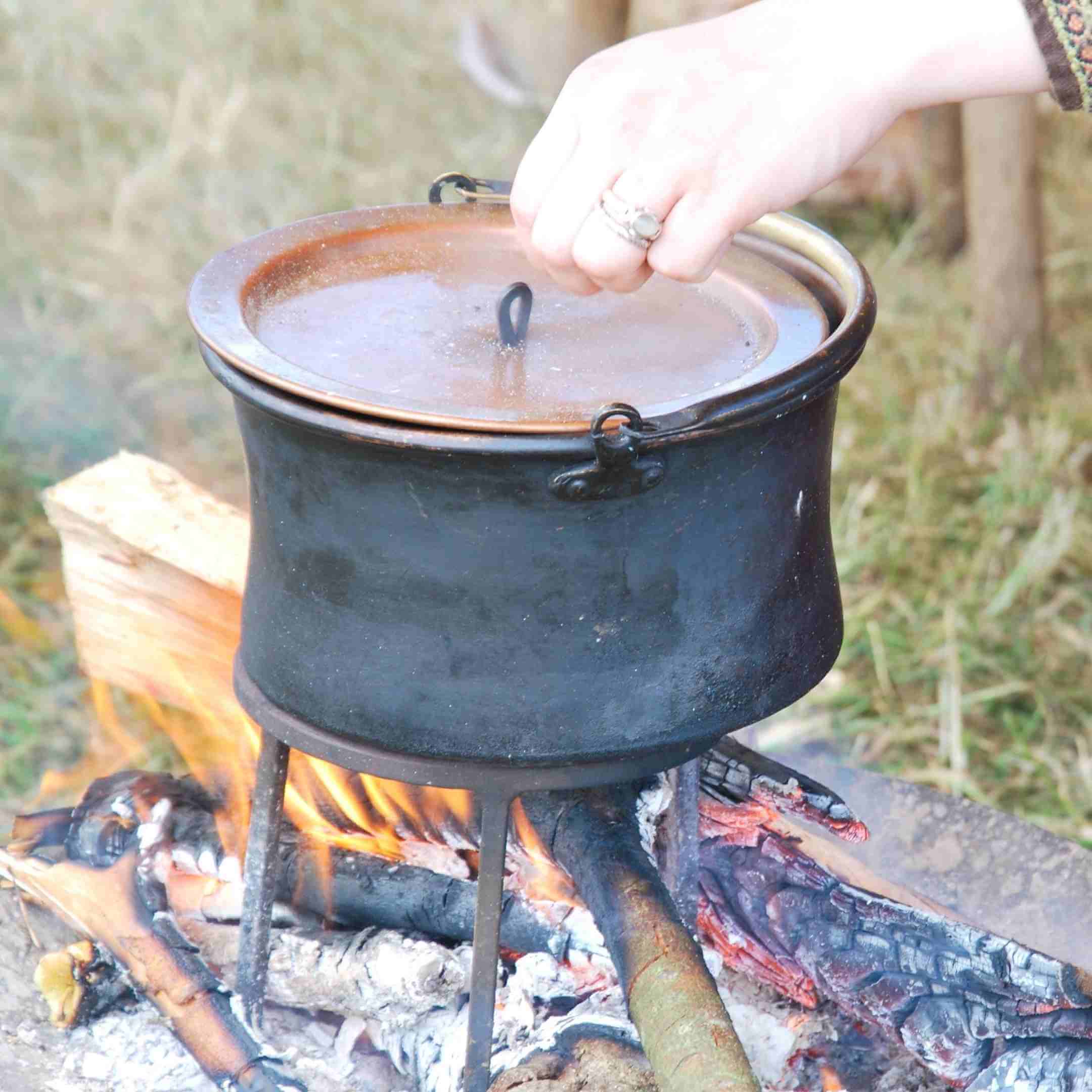 People Cook Over Open Fire