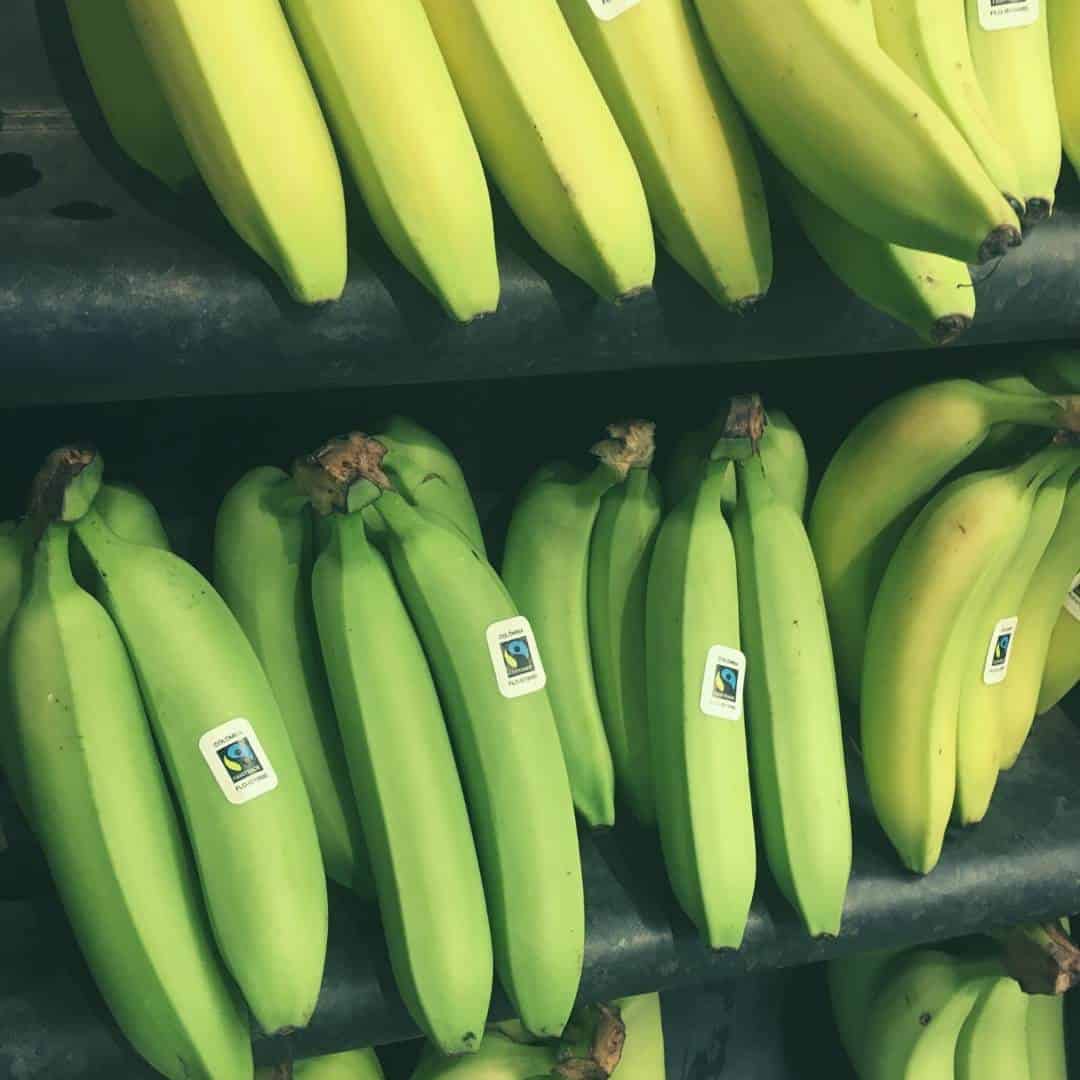 green bananas in the shop