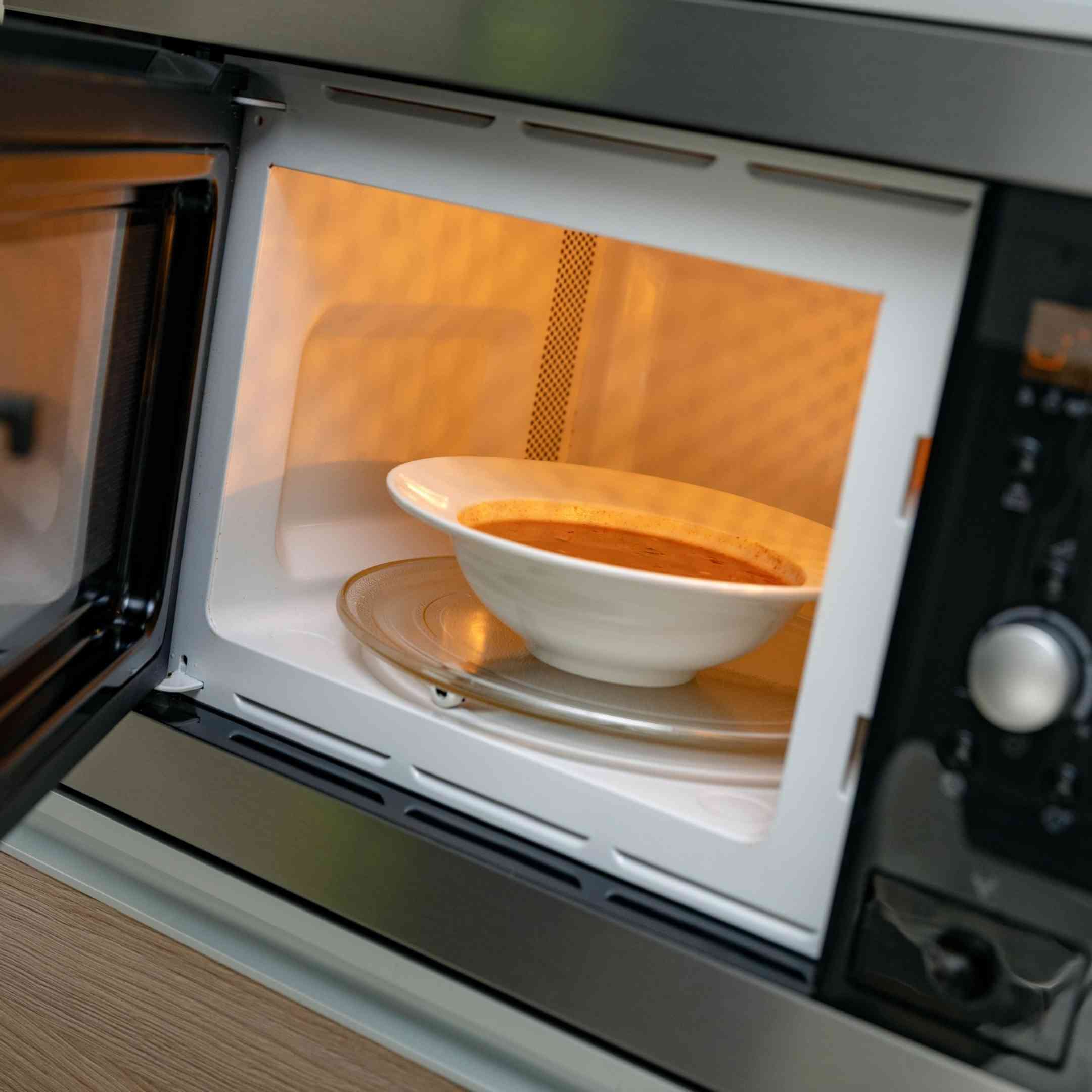 a bowl of soup in the microwave