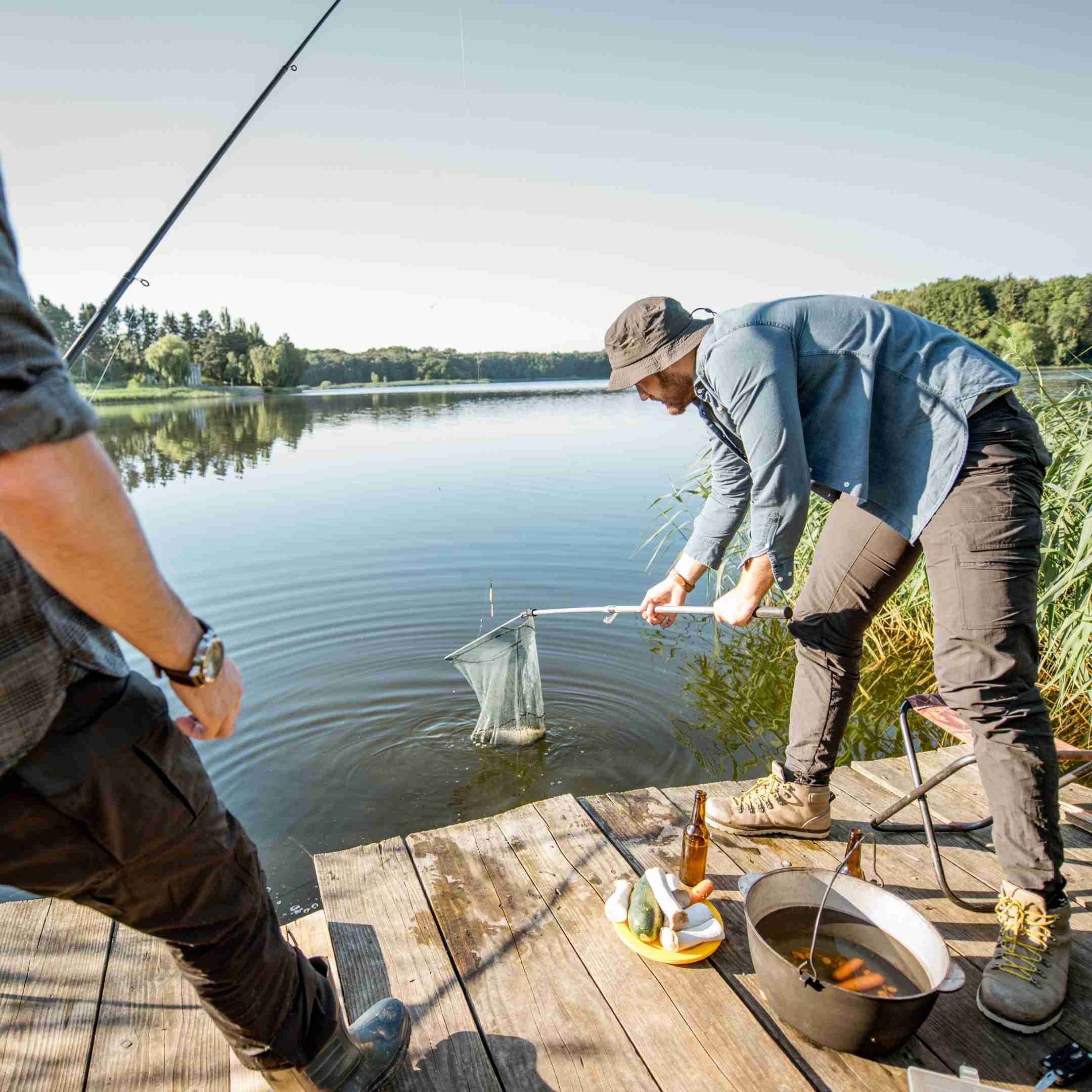 a fisherman is storing a fresh catch 