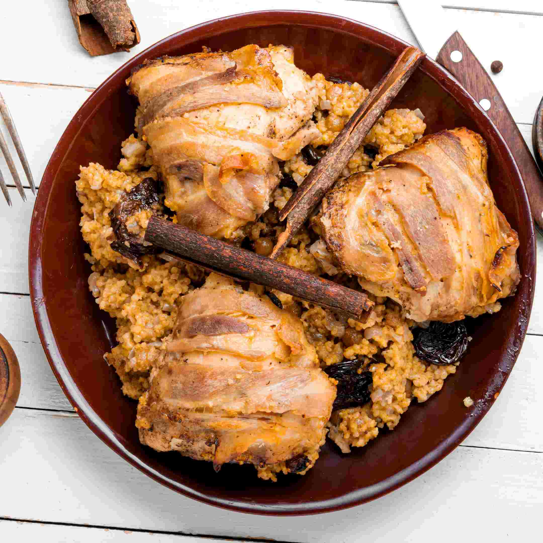 slow cooked chicken with cinnamon sticks on top