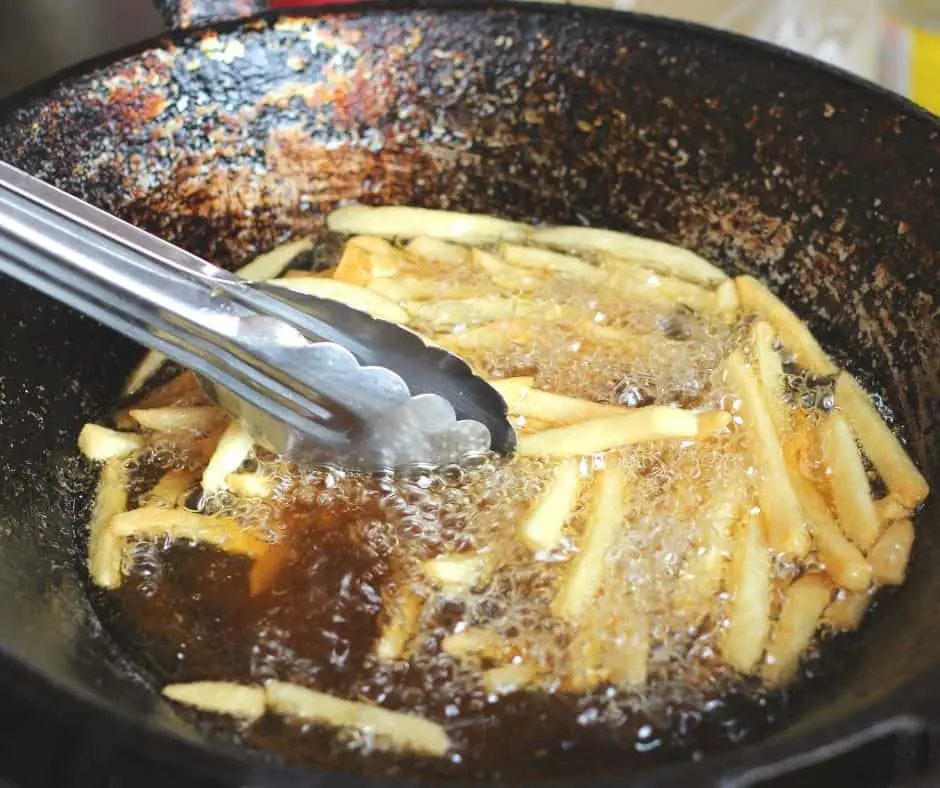 frying frozen fries in a pan