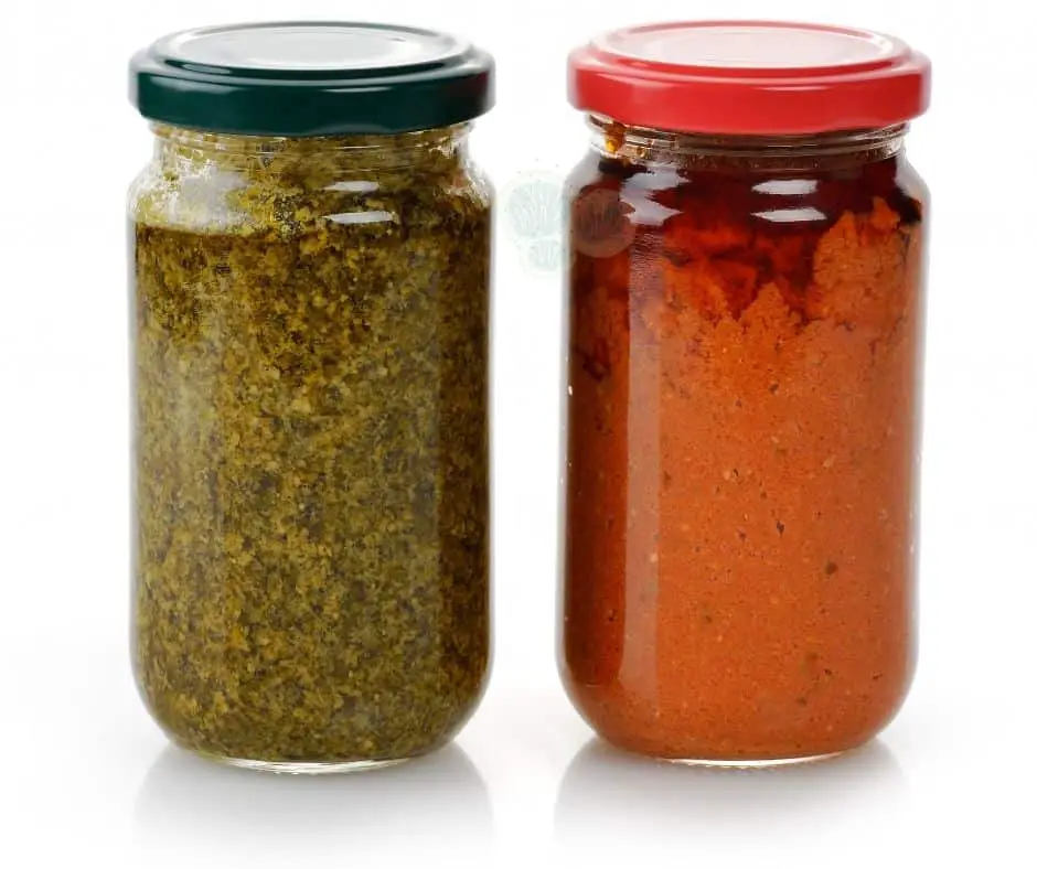 green and red pesto in jar