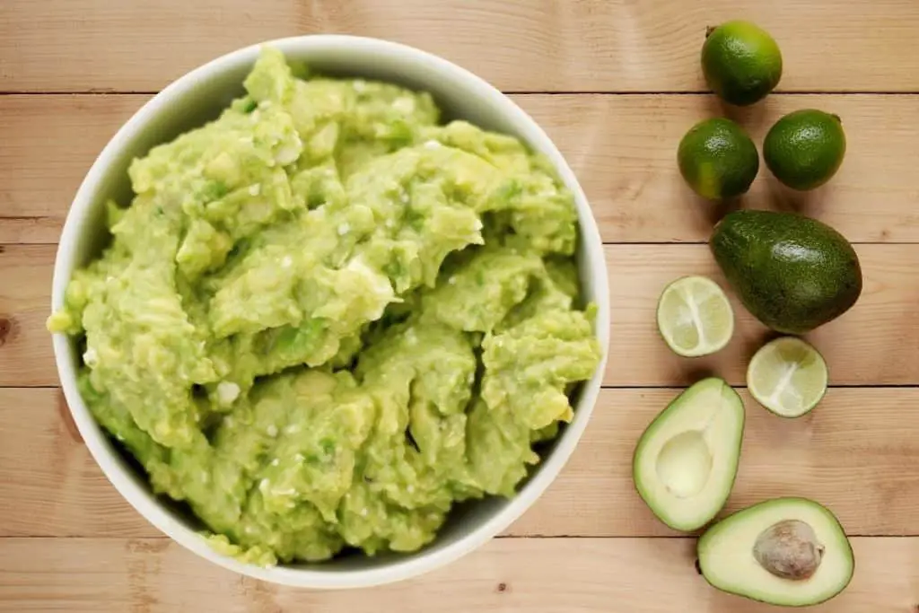 guacamole made from mashed avocados