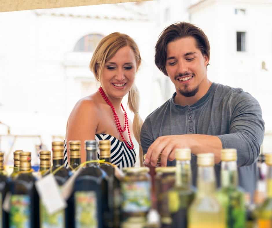 a couple is choosing the best quality olive oil