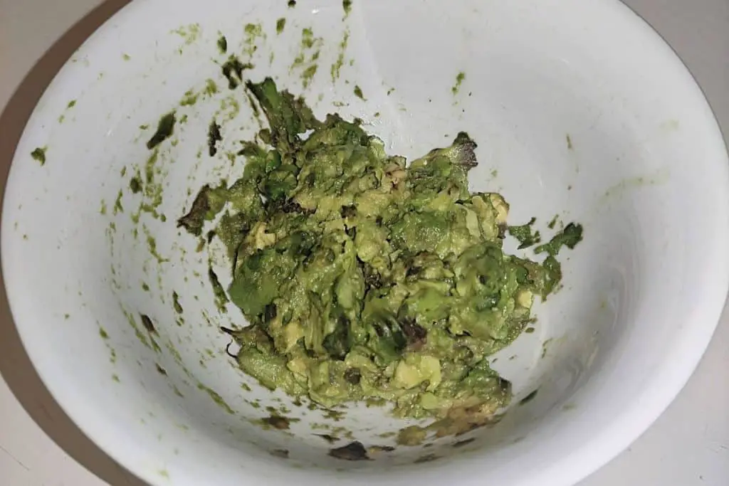 mashed avocado in a bowl that has starting to go brown