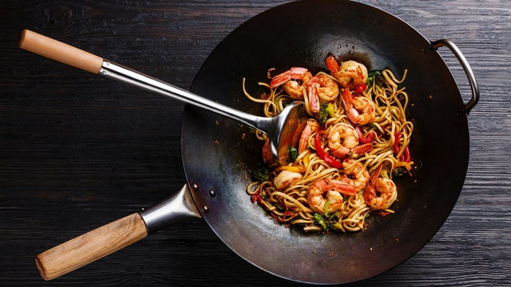 cooking with a wok pan at home