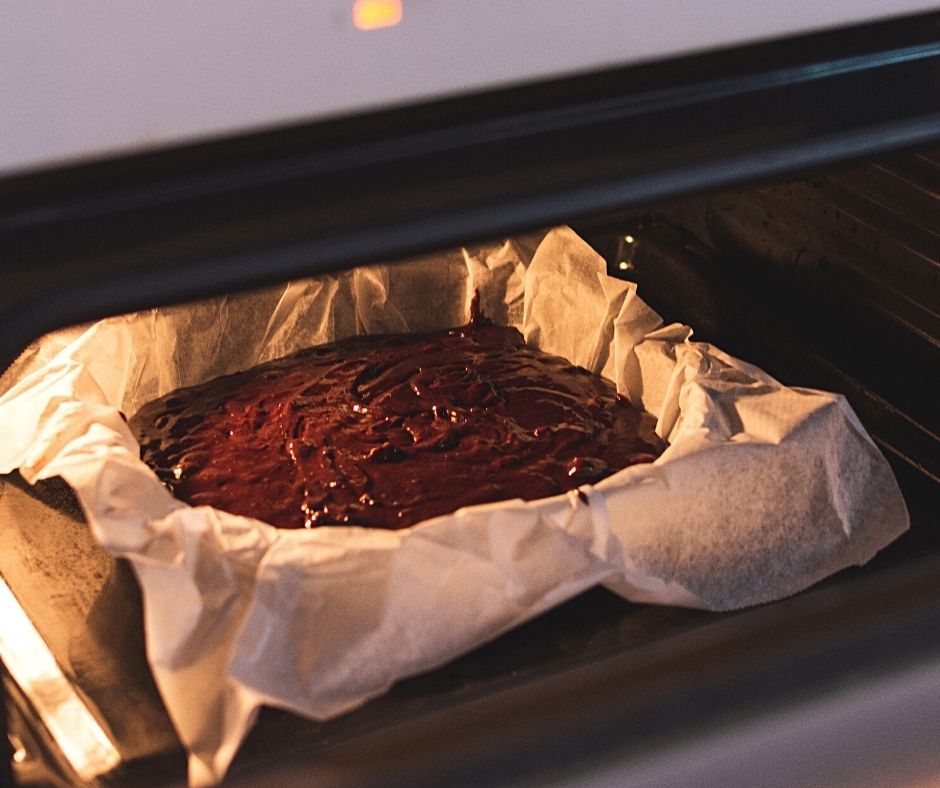 pan of brownie in the hot oven