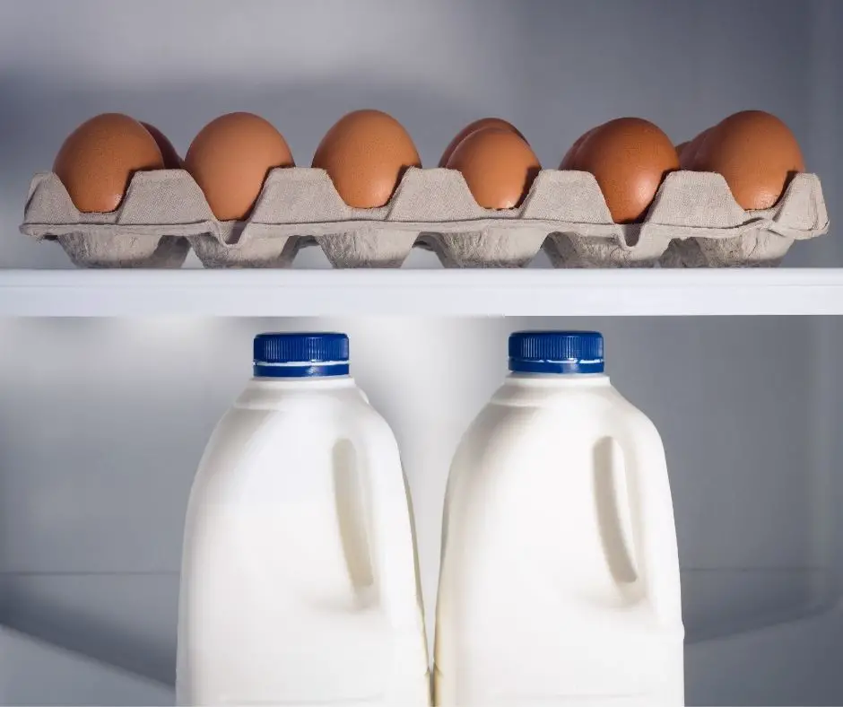milk and eggs in the fridge shelf
