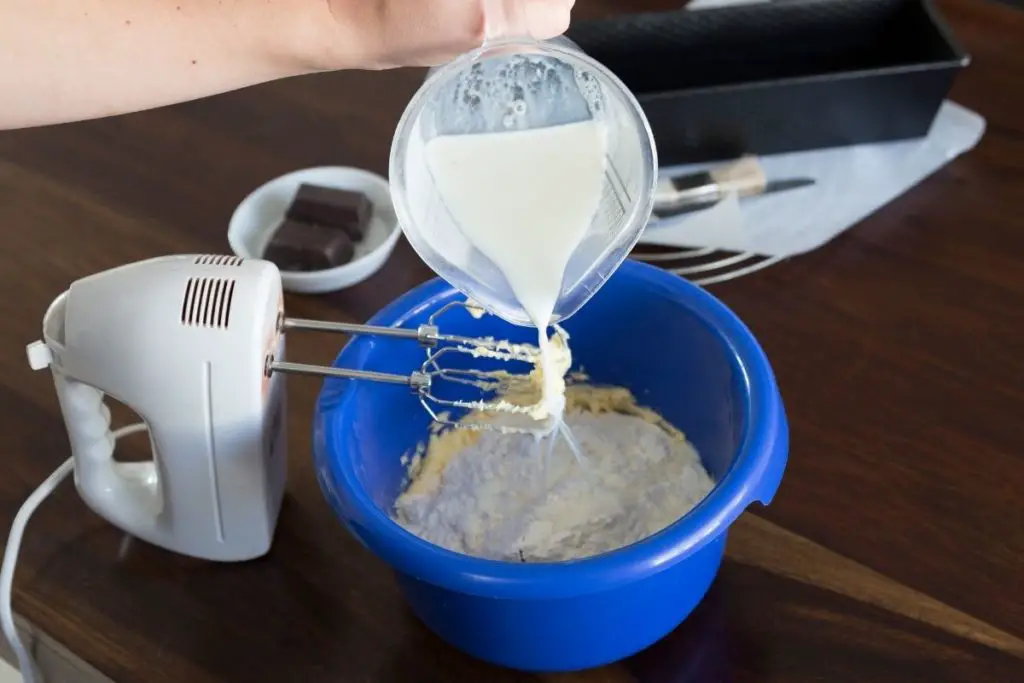 adding milk to cake mix