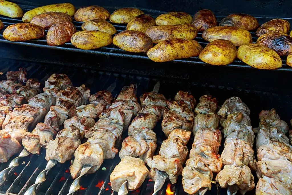 baked potato on a charcoal grill