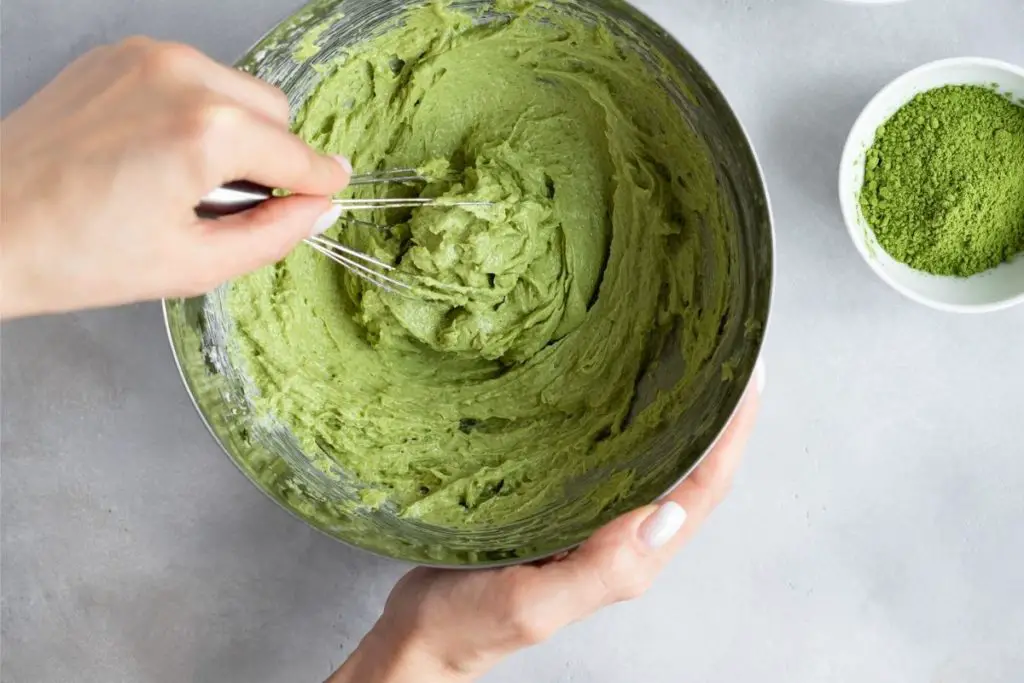 mixing Matcha powder into the cake mix