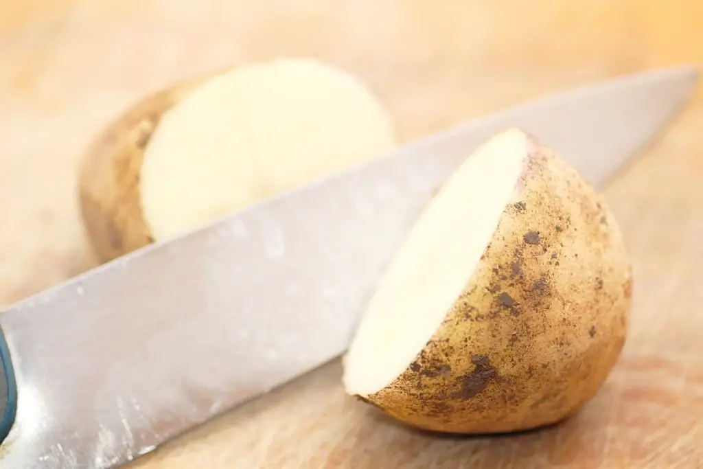 cutting potato in half before baking