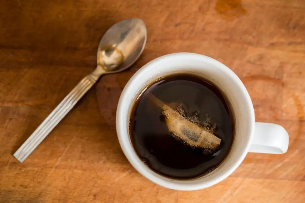 steeping a tea bag in the cup