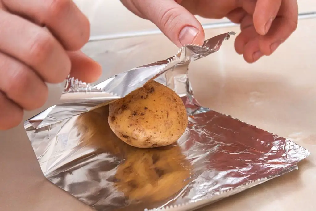 wrapping potatoes in foil before baking 