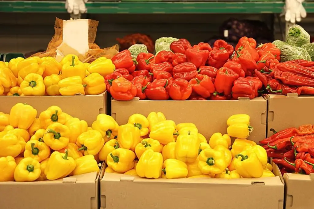 bell peppers stacked at farmers markets