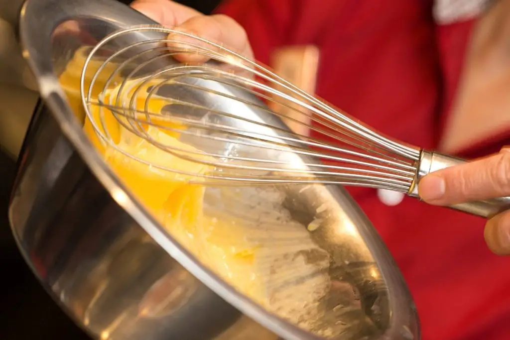 whisking the egg