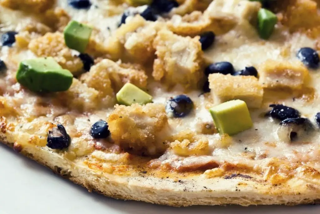 breaded chicken and avocado pizza topping