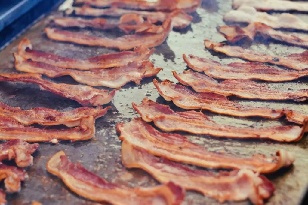 baking sheet with foil and add the bacon.