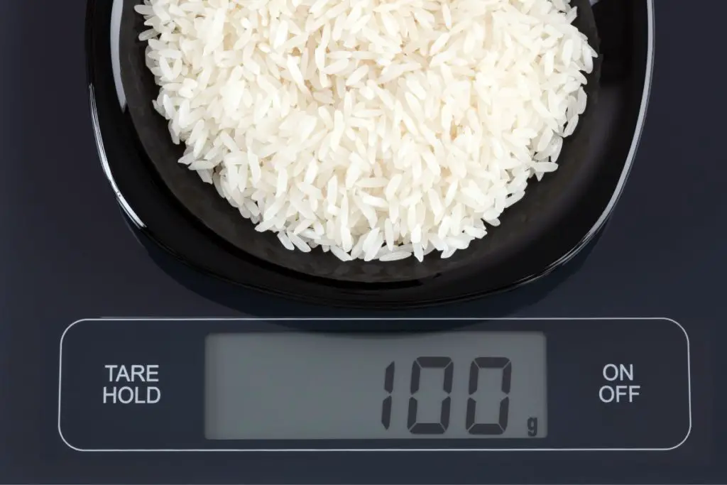 cup of rice on the kitchen scale grams