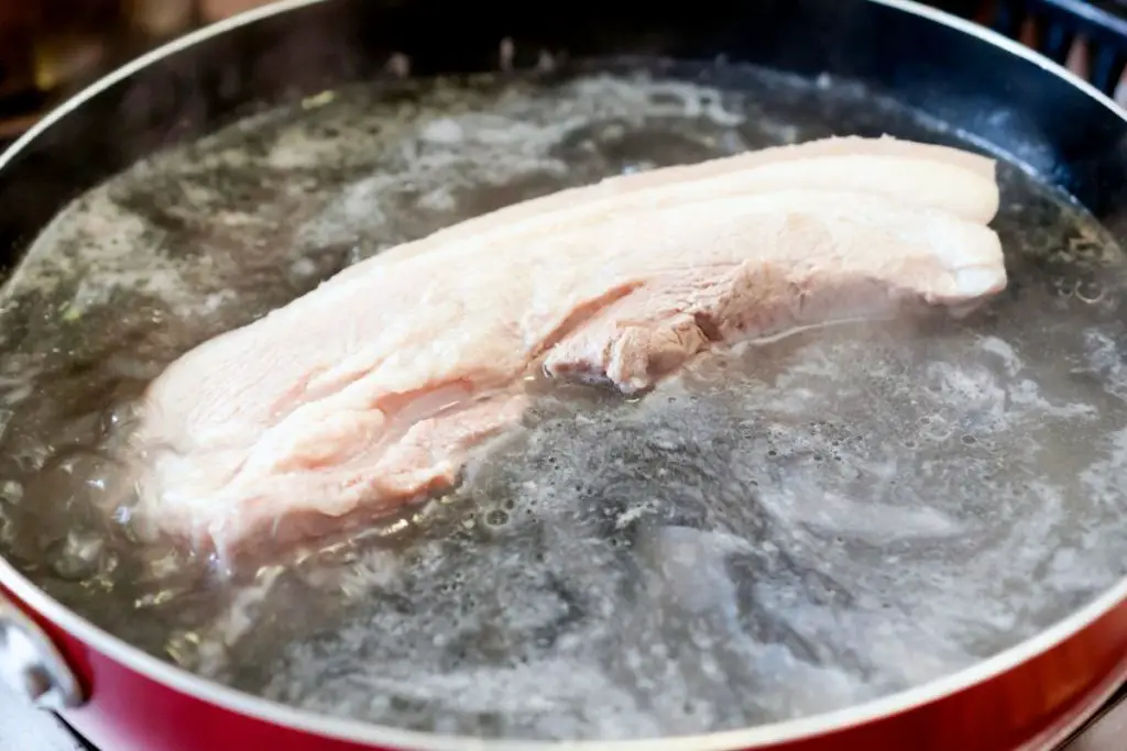 simmering pork on stove top