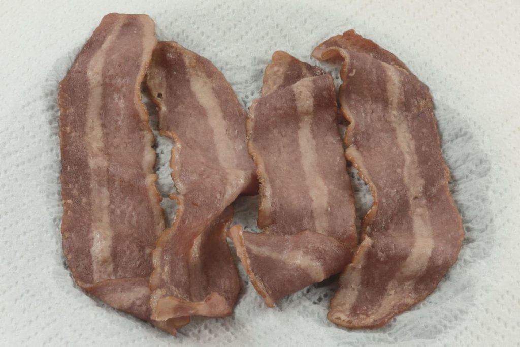 microwave cooked bacon on a paper towel