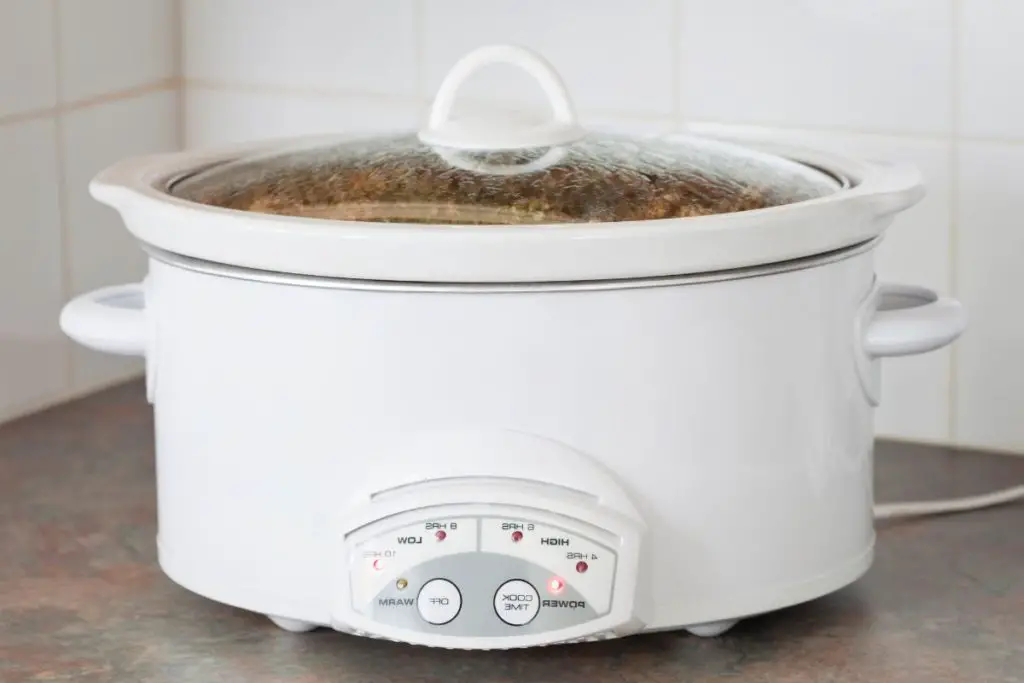 corned beef with sauerkraut and potatoes in crock pot