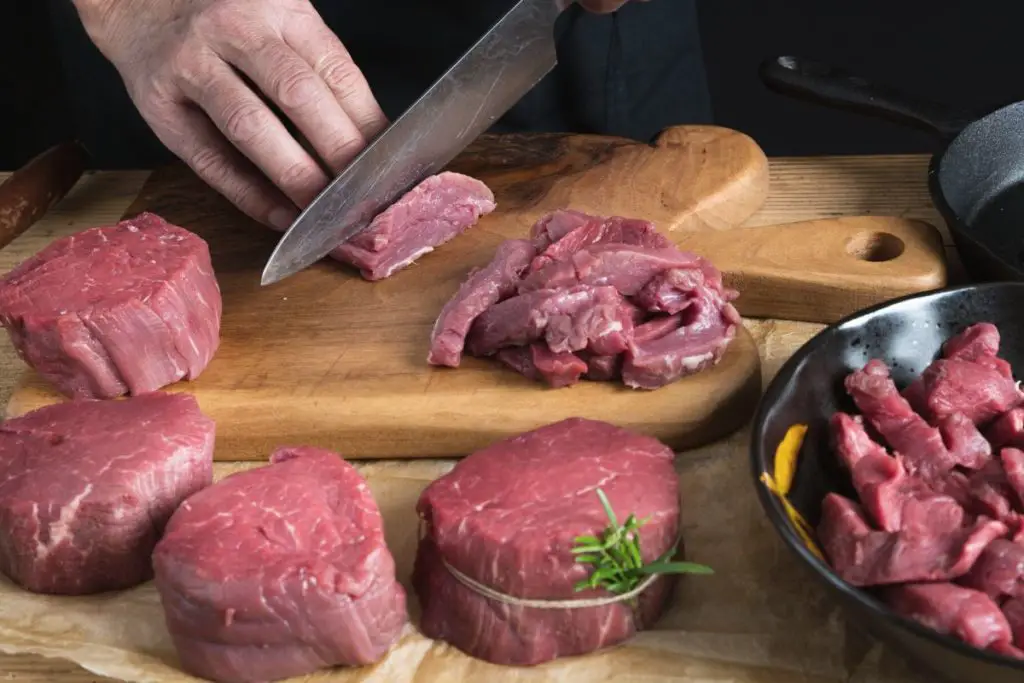 cutting beef into strips for stir fry