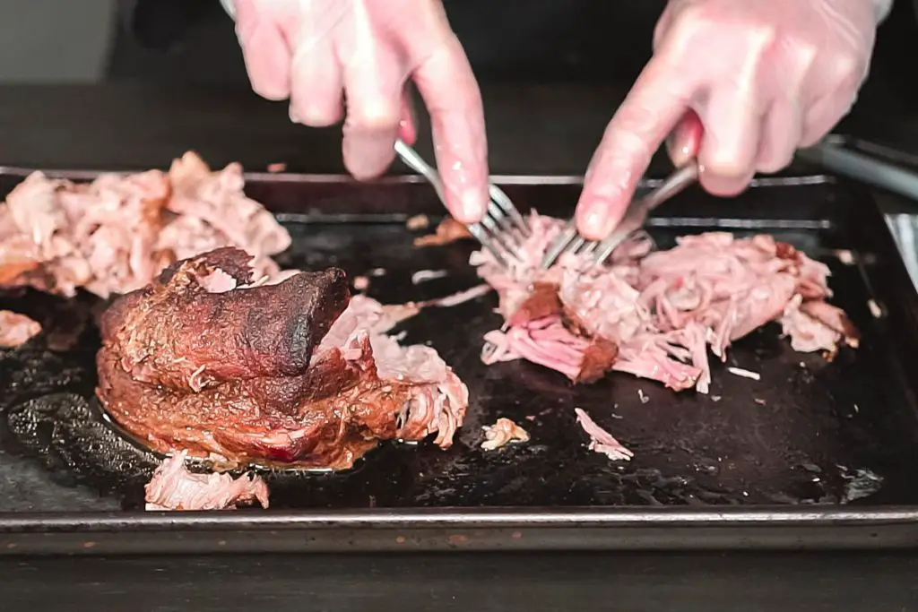 shredding tender piece of pork