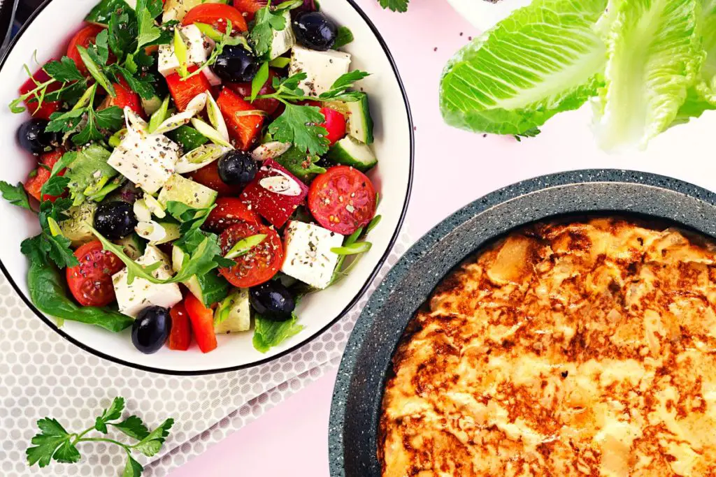 feta romaine salad served with Spanish omelet