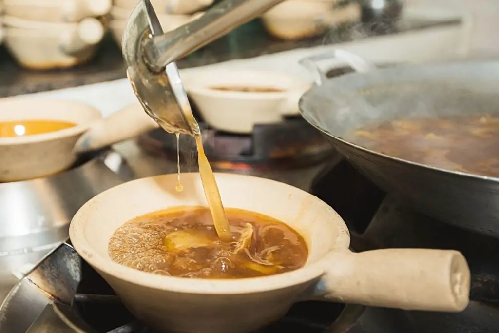 making soup in a wok