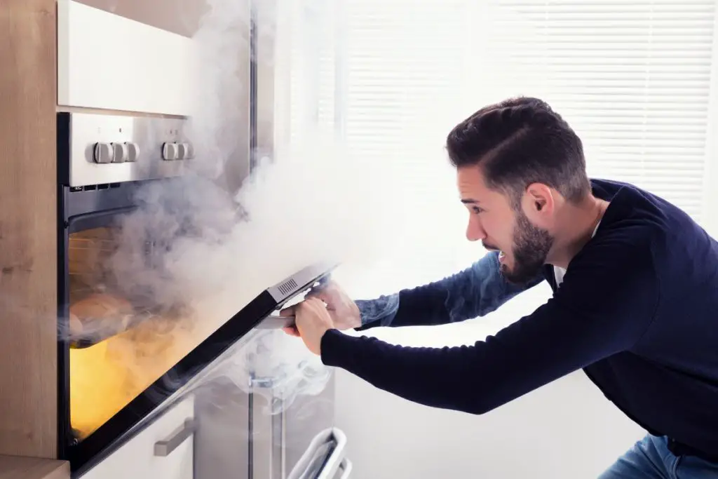 smoke and flames coming out of the oven