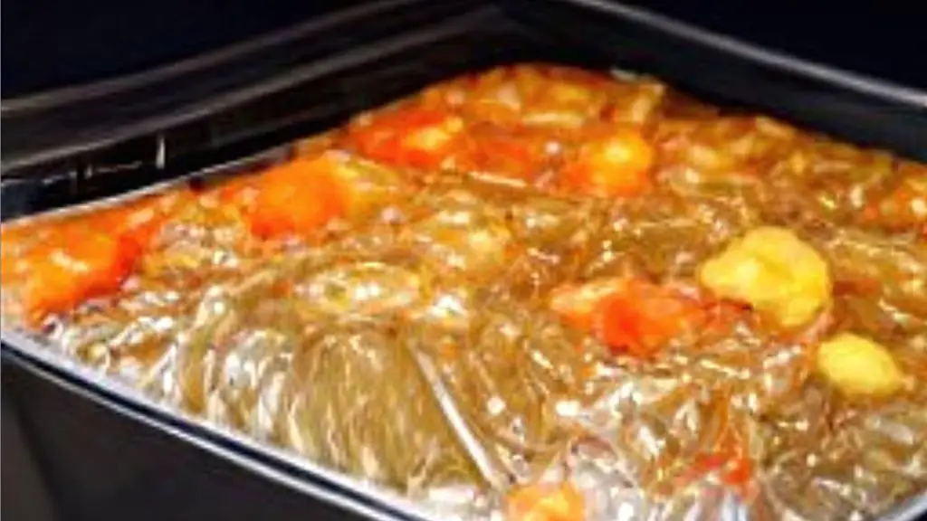 casserole dish wrapped in plastic wrap in the hot oven