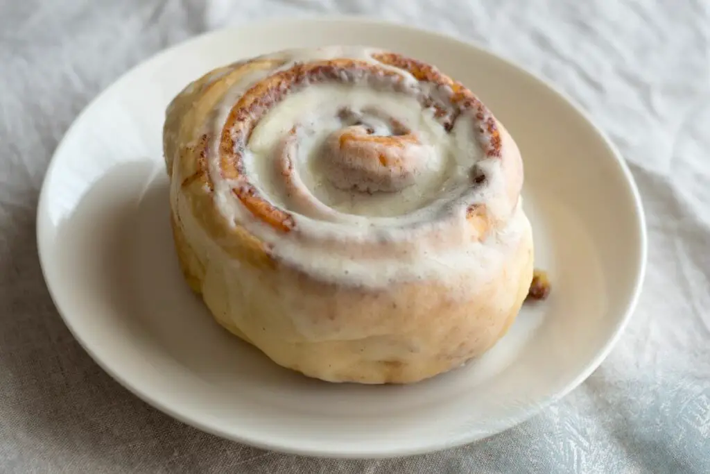 cinnamon rolls with frosting on the top
