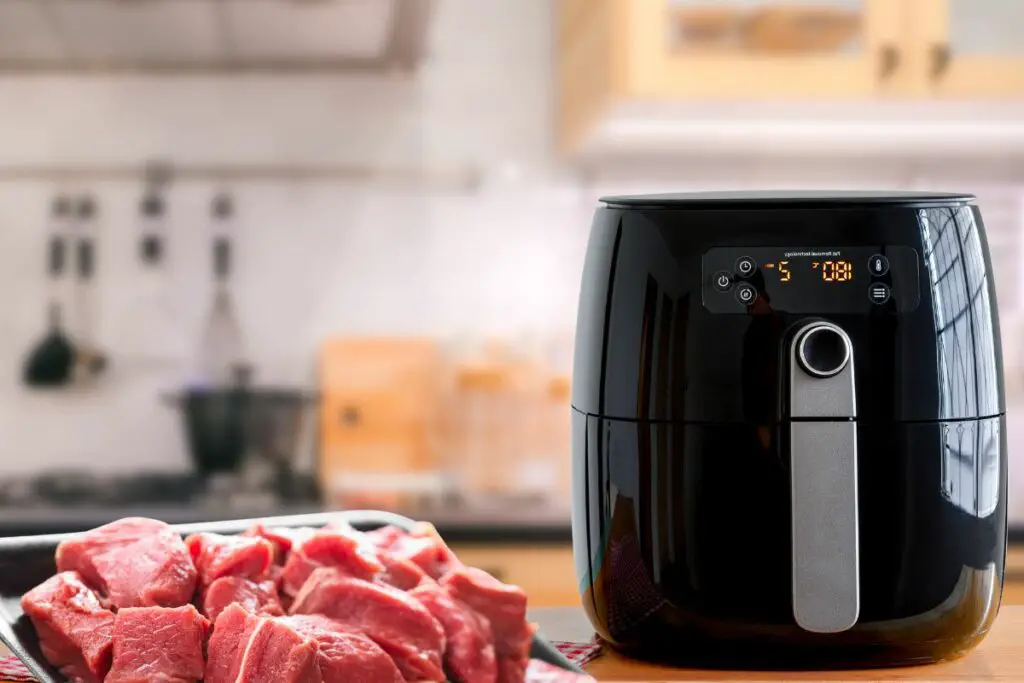 air fryer on the kitchen counter with stake cubes 
