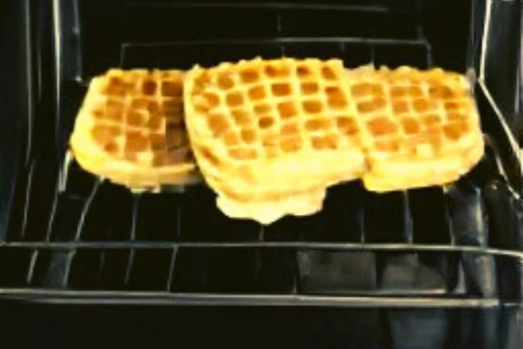 keeping the finished waffles warm and crisp in an oven