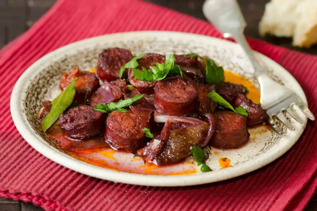 fried chorizo slices on a plate