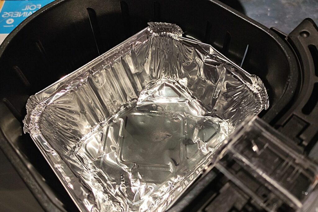 aluminium pan inside the air fryer basket