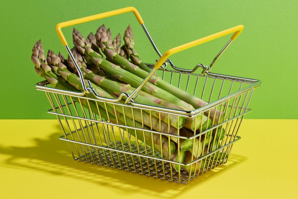 fresh asparagus in the shopping basket 