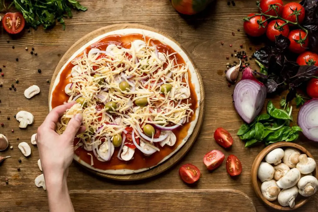 Making mushroom pizza at home 