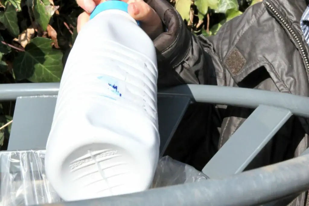 throwing away a milk bottle 