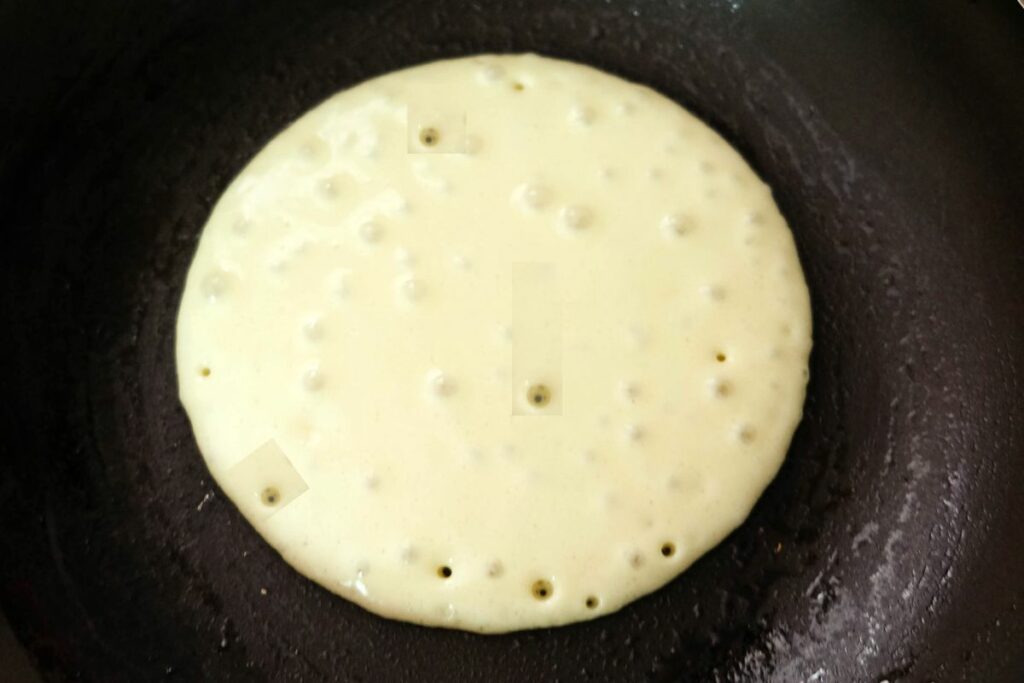 now it is time to flip the pancake when you see the bubbles 
