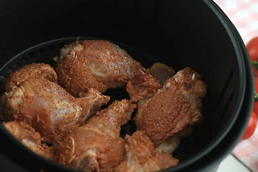 raw chicken wings in air fryer basket